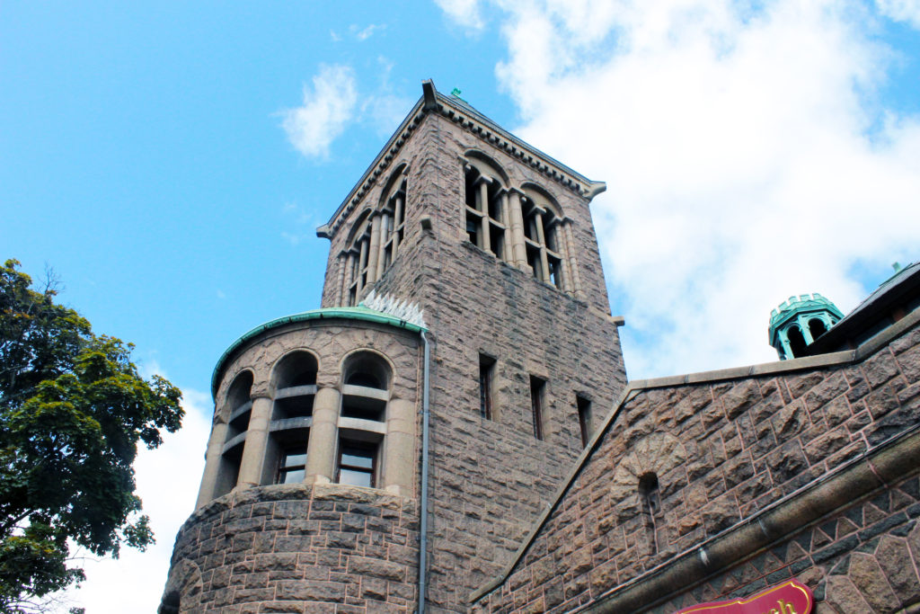 A large brick building with a clock tower.