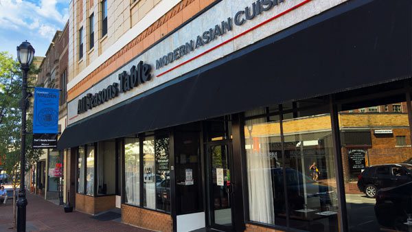 A restaurant with a large sign on the front of it.