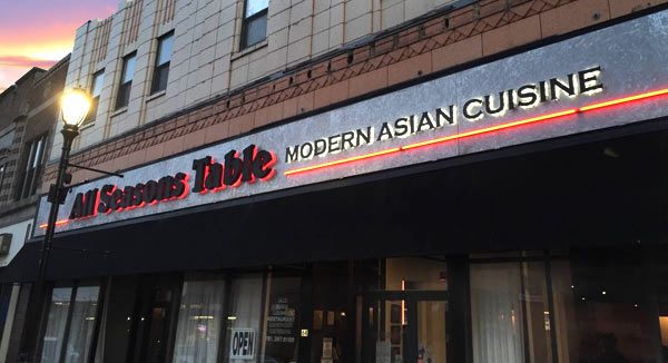 A restaurant sign that says " texas table modern asian cuisine ".