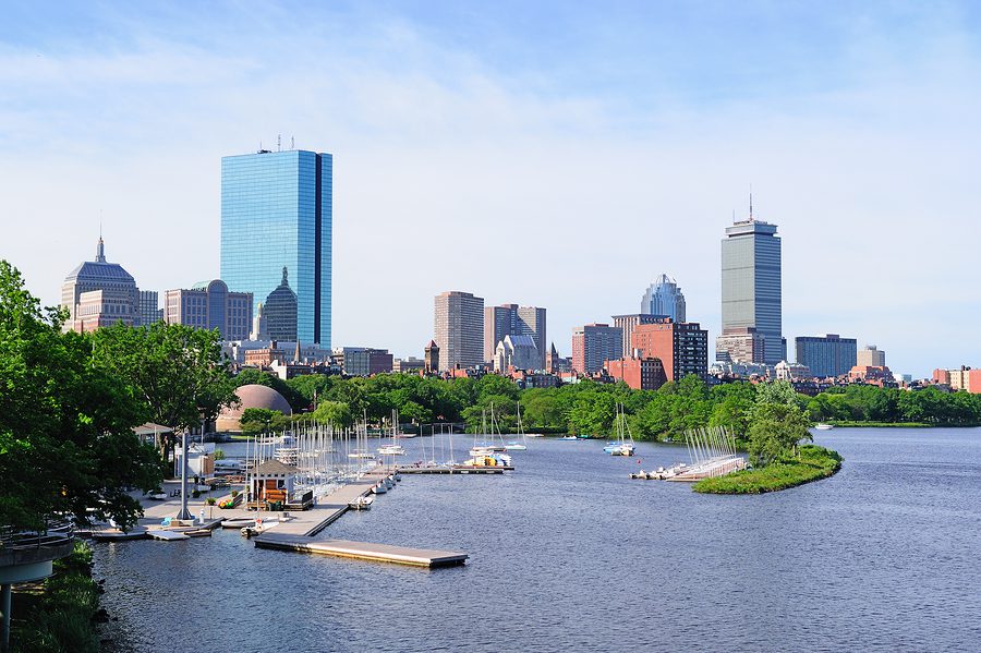 A view of the boston skyline from across the water.