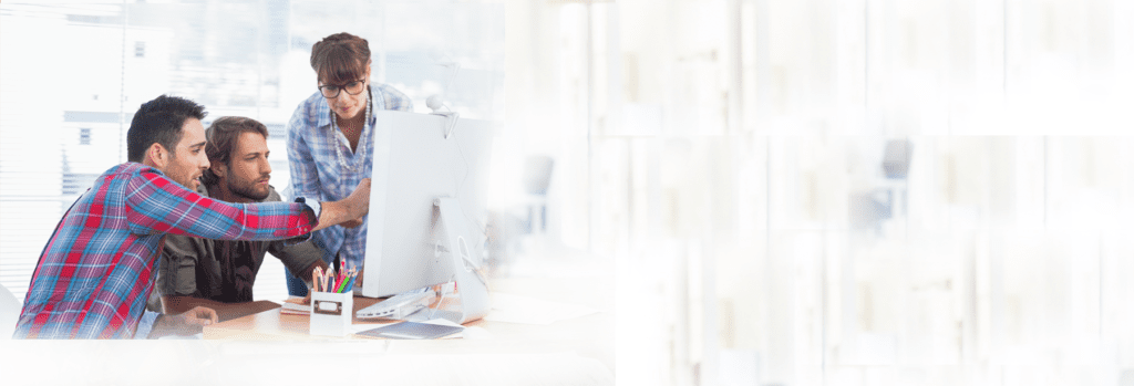 A blurry picture of a desk with a computer.