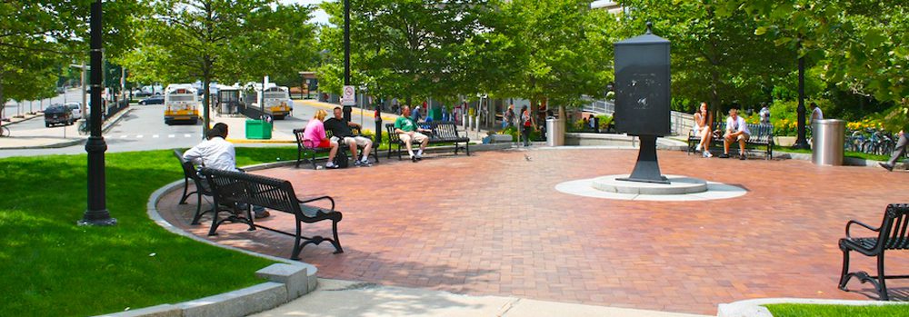 A group of people sitting on top of benches.