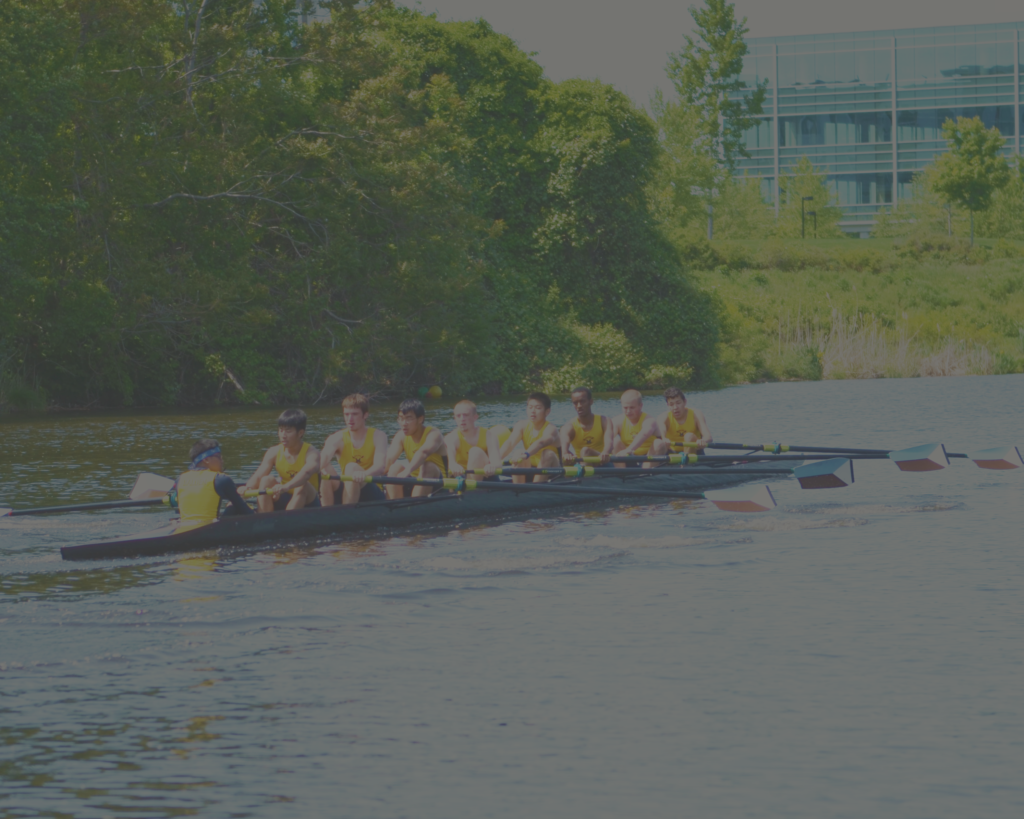 A group of people in a boat on the water.