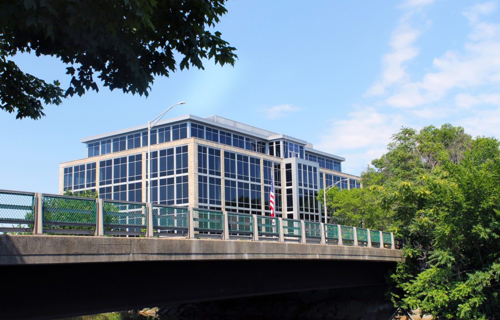 A bridge with a building in the background