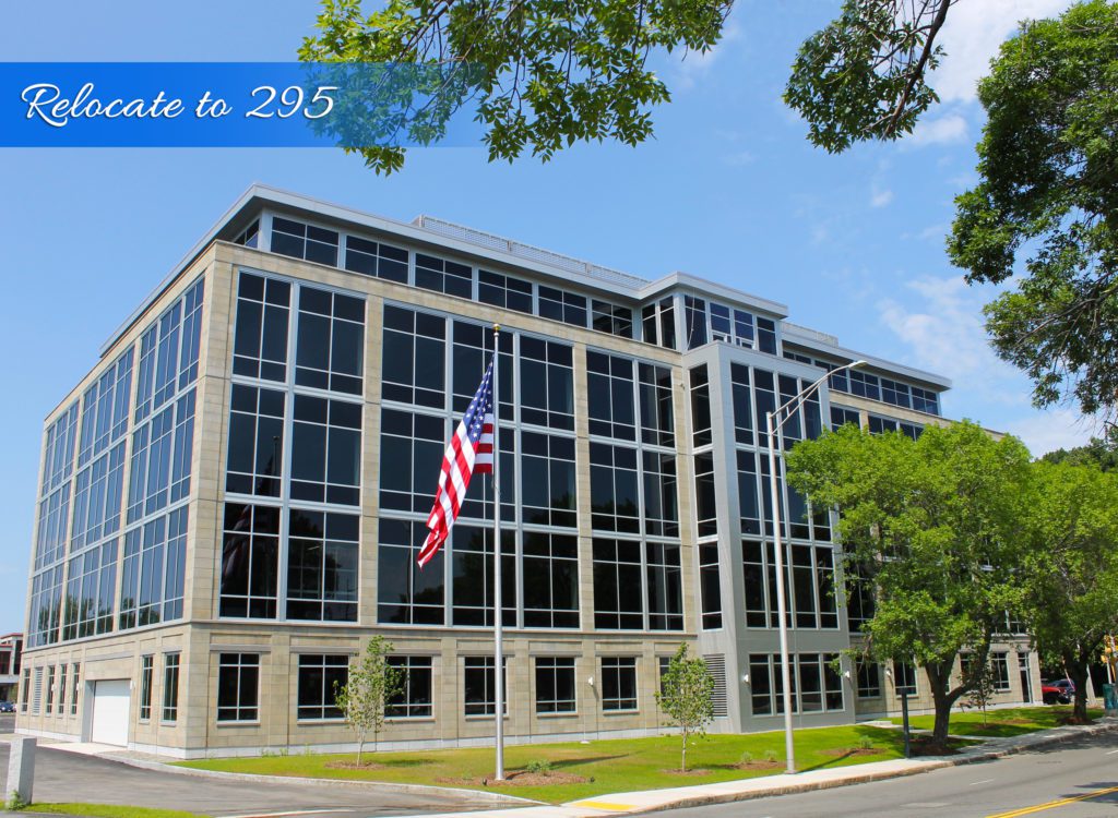 A large building with american flag on it.
