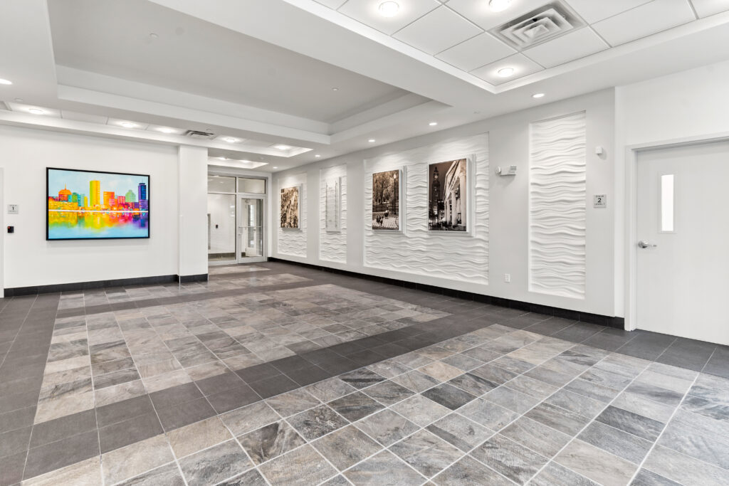 A large room with many pictures on the wall