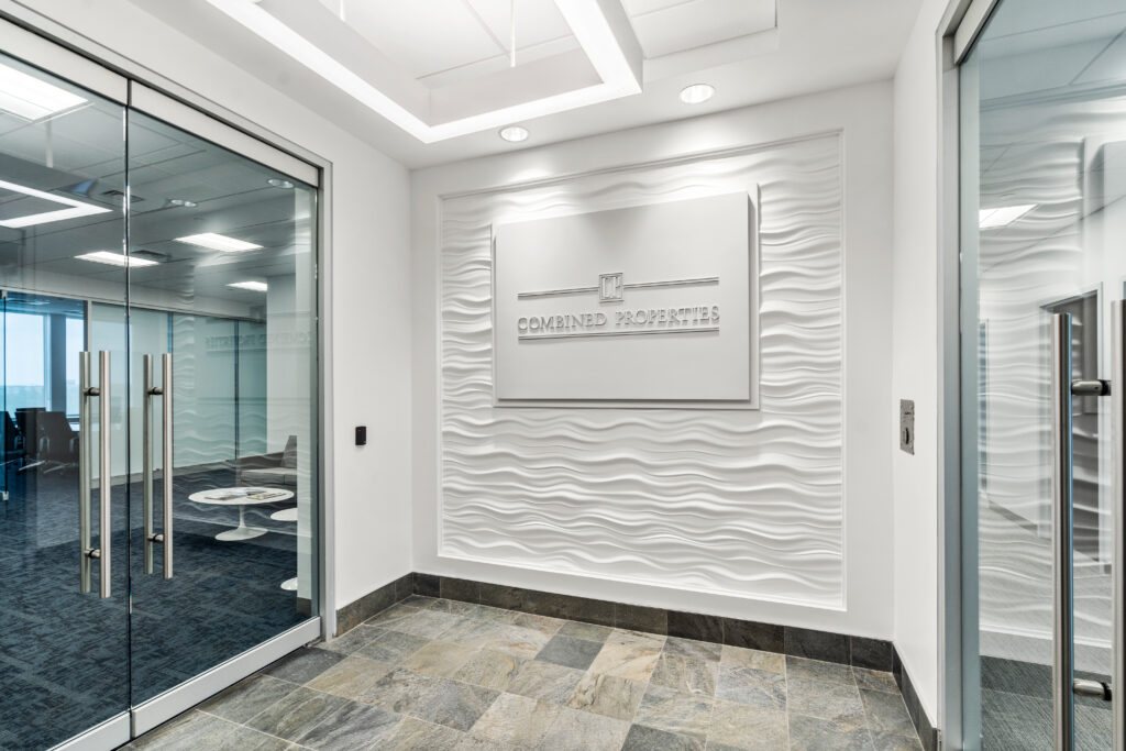 A white wall with a picture on it