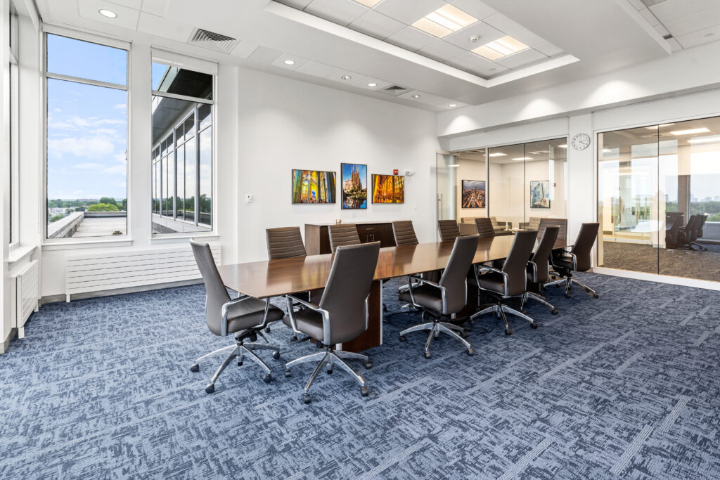A conference room with chairs and tables in it