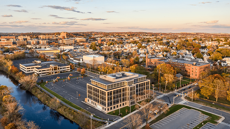 An aerial view of a city with buildings and trees.