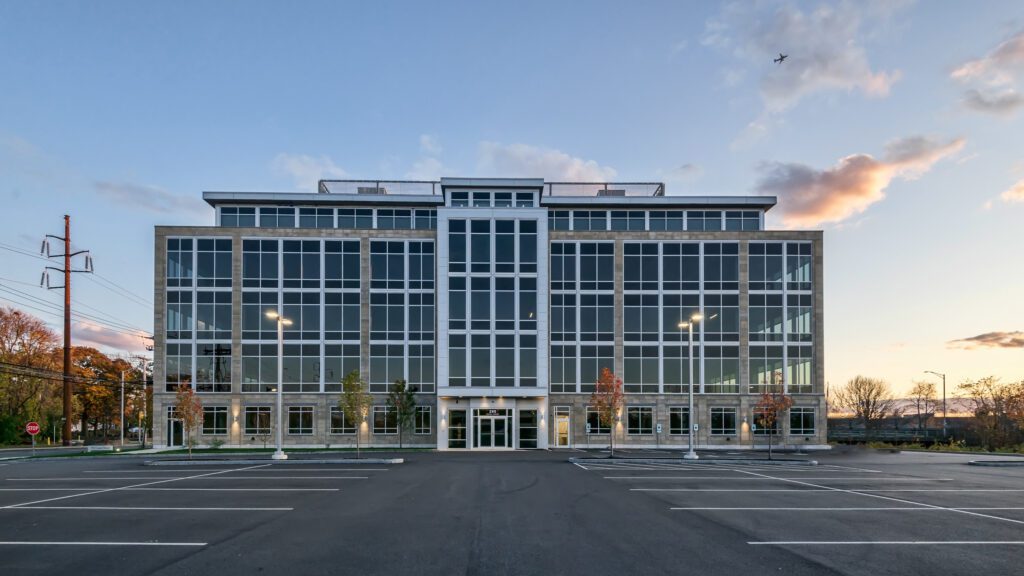 A large building with many windows and lights