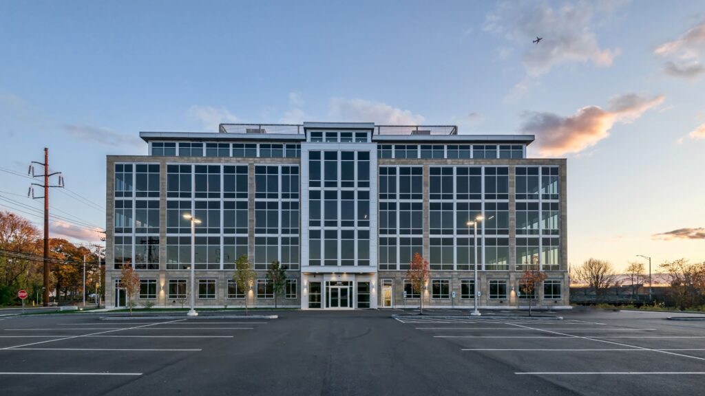 A large building with many windows and lights on it