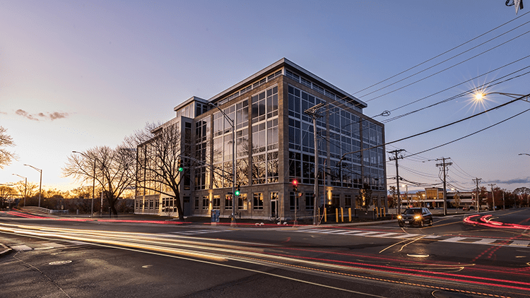 A building with glass windows on the side of it.